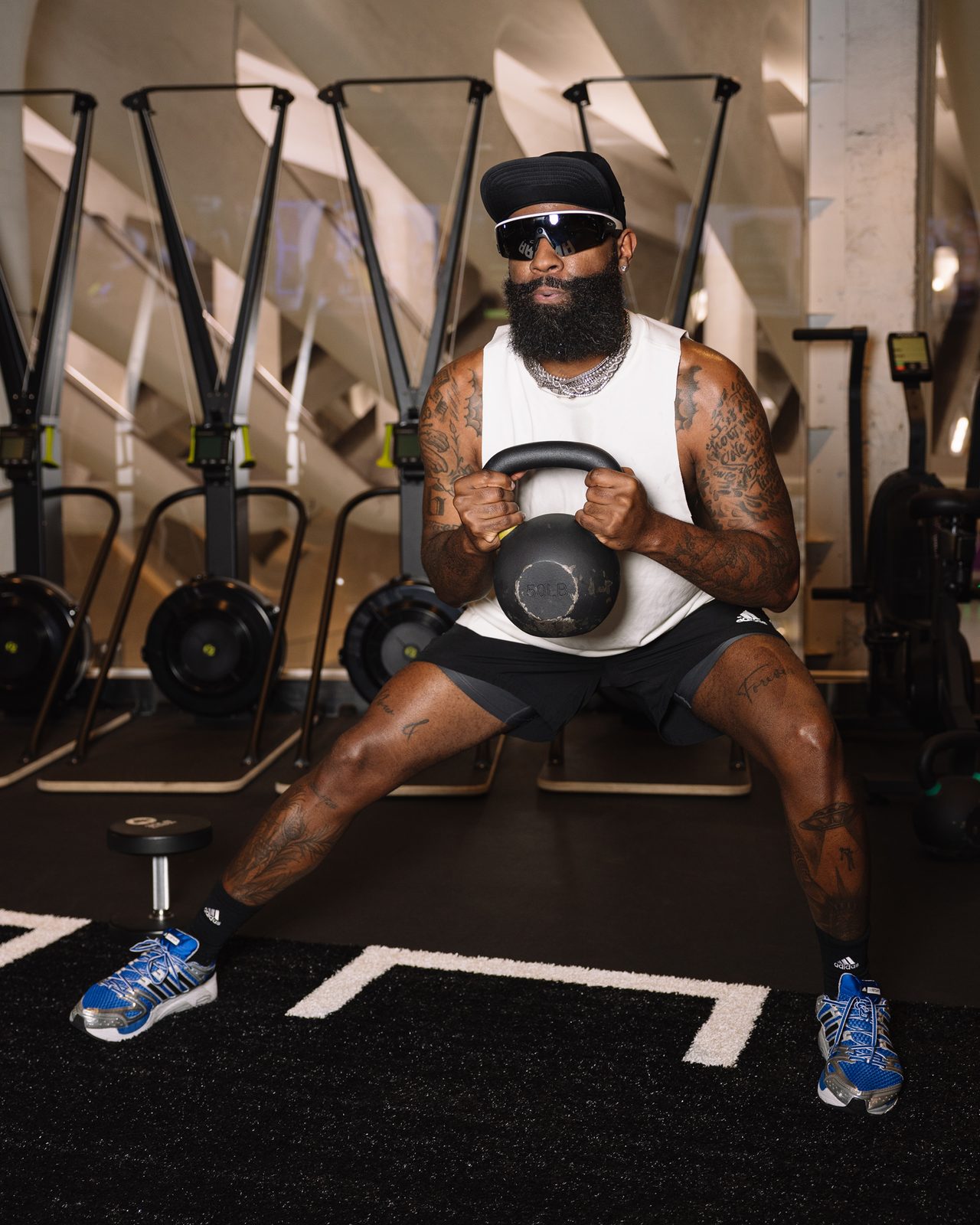 Athlete in a kettlebell goblet squat inside The Oculus, GÜDSPORT WTC